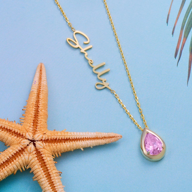 A custom pendant necklace with a teardrop pink tourmaline gemstone on an 18” cable chain with a lobster clasp.