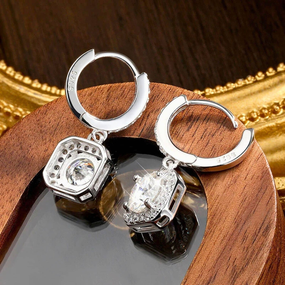 Sterling white gold diamond drop earrings with round halo and pave detailing