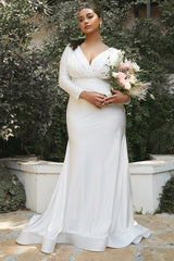 white satin long sleeve wedding gown